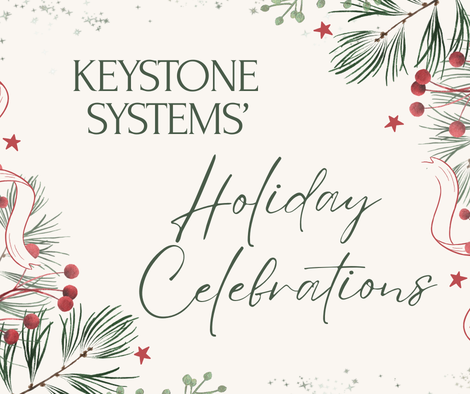 A cheerful graphic with text "Keystone Systems' Holiday Celebrations," surrounded by evergreen boughs and red berries and stars.